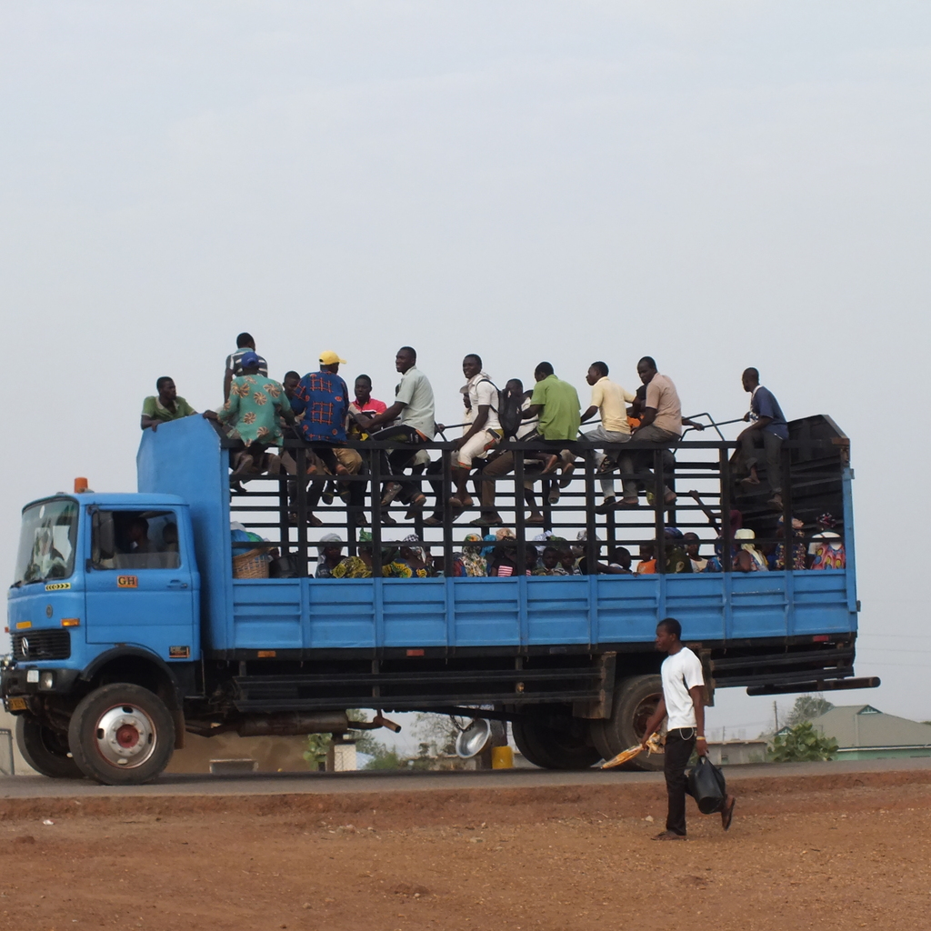 People on a truck. Photography by Remo Kurka